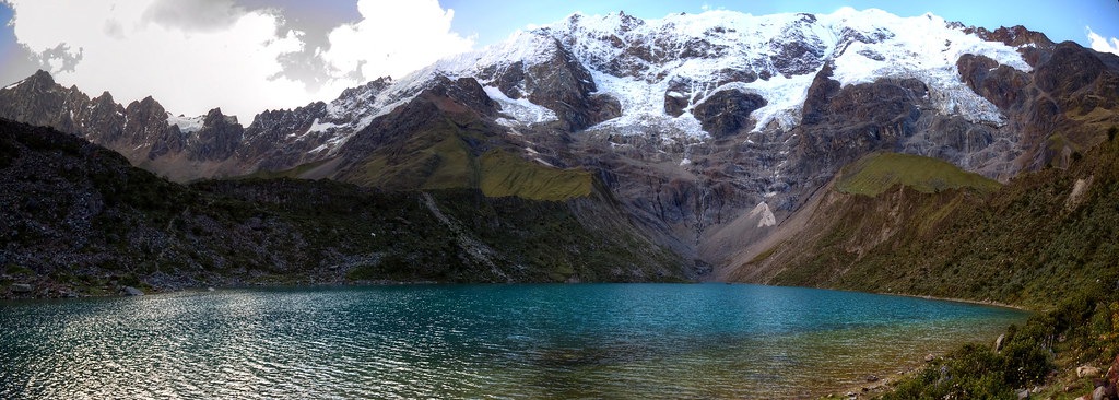Humantay Lake turquoise glacial waters with snow-capped Andean mountains near Cusco Peru